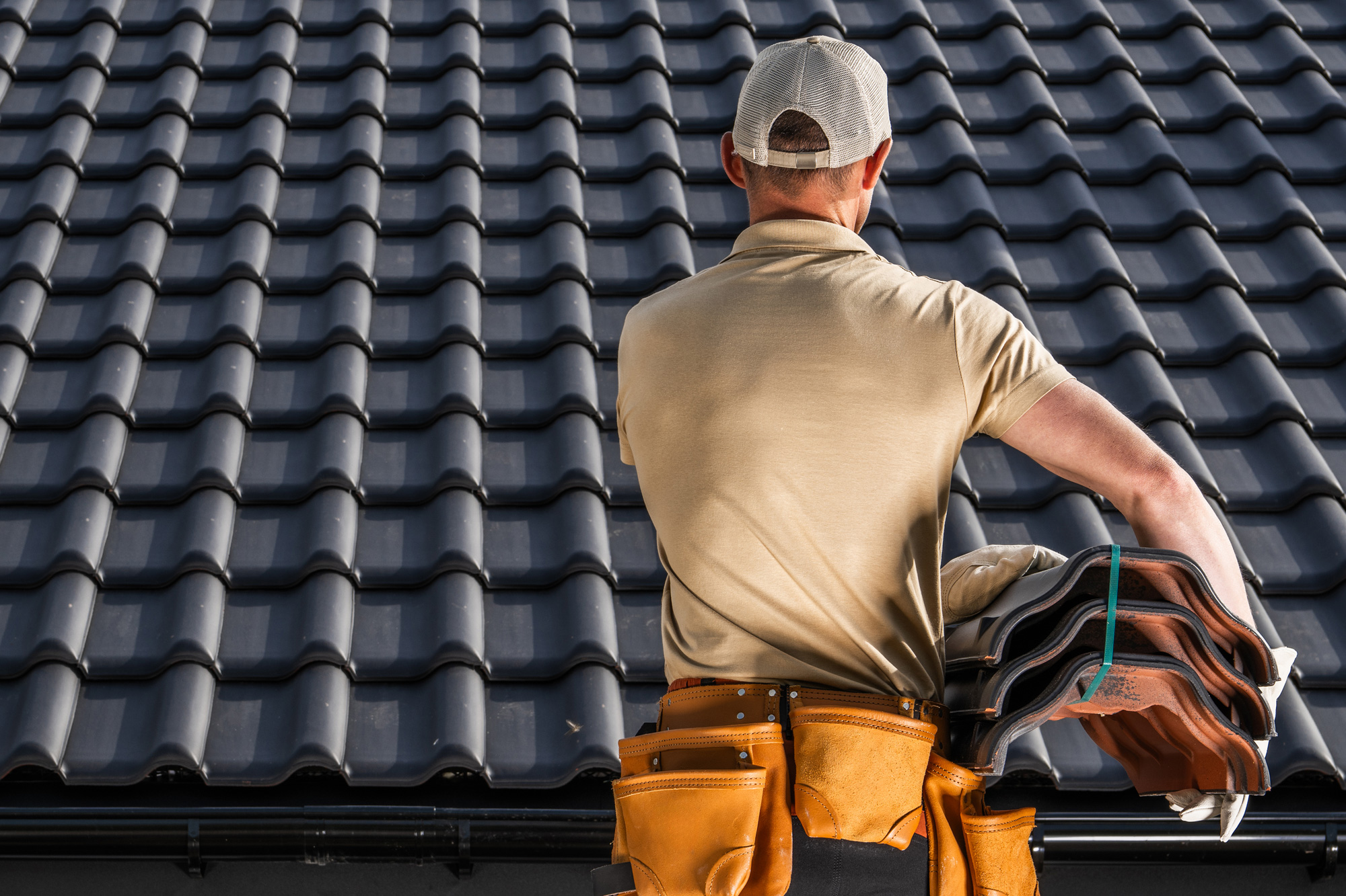 Roofer standing in front of completed roof in nailsea Roofer standing in front of completed roof in nailsea