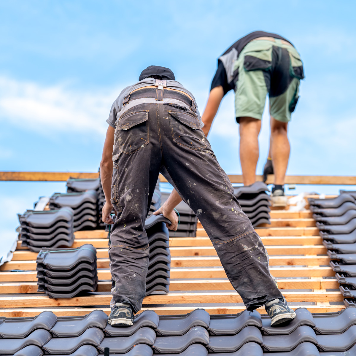 Roofer installing new roof Roofer installing new roof