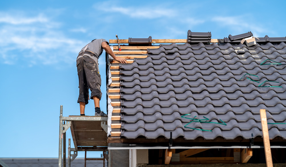 Roofer installing new roof